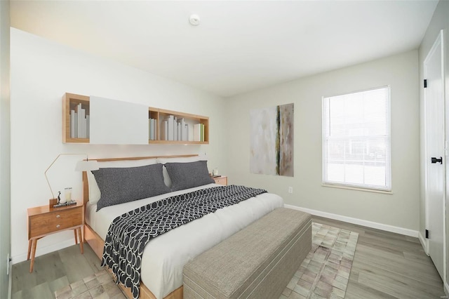 bedroom with light wood-type flooring