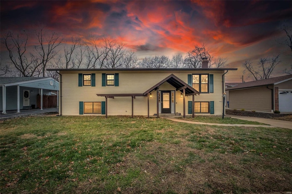 view of front of home with a lawn