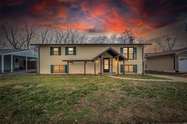 view of front of home with a lawn