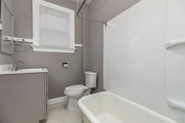 bathroom featuring tile patterned floors, vanity, and toilet