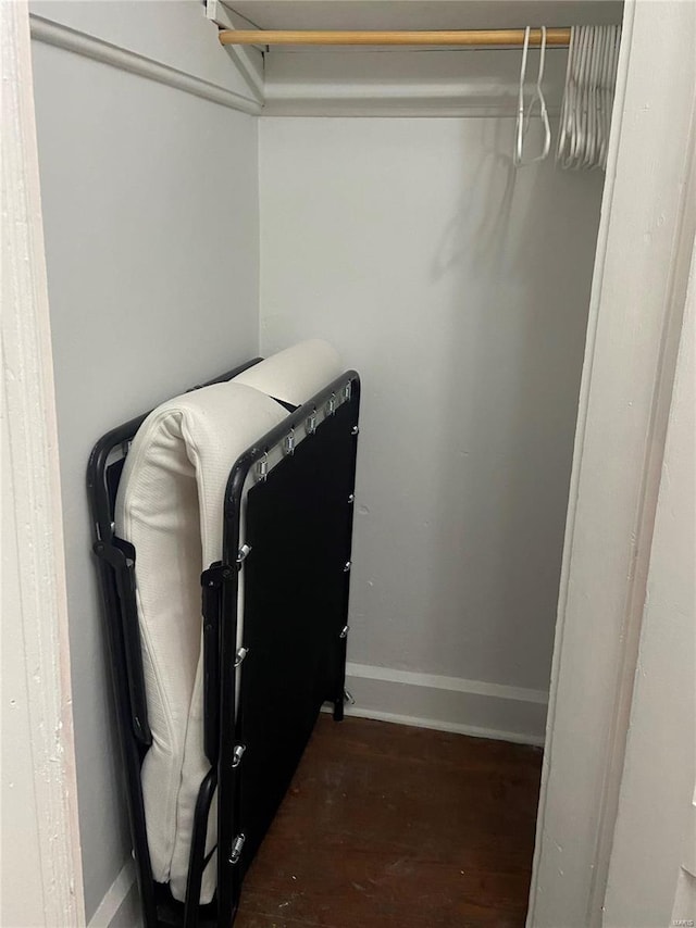 spacious closet featuring dark hardwood / wood-style floors