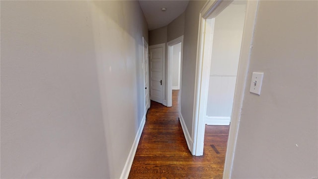 hall with dark wood-type flooring