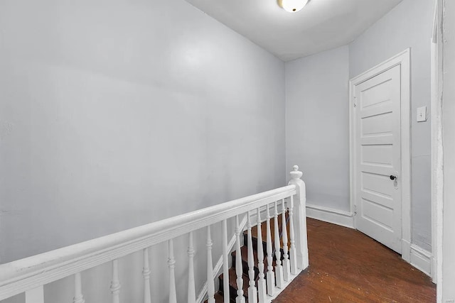 corridor featuring dark hardwood / wood-style flooring