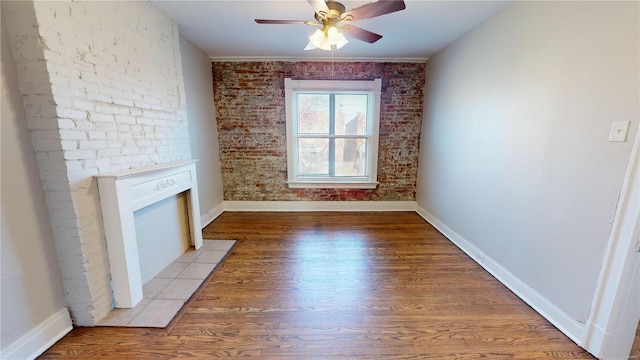 unfurnished living room with a fireplace, ceiling fan, and light hardwood / wood-style flooring