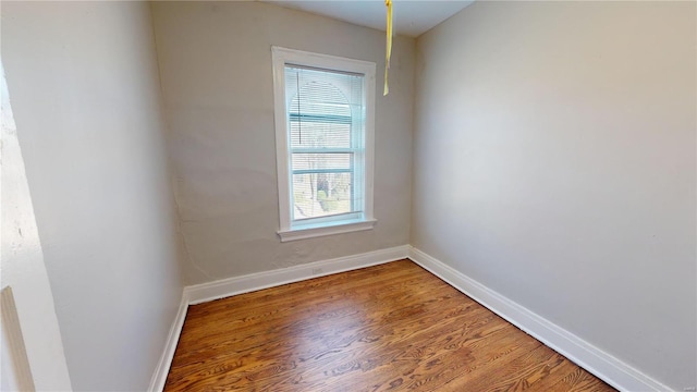 spare room with hardwood / wood-style flooring