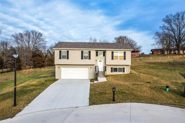 split foyer home with a front lawn and a garage