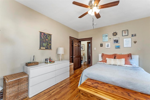 bedroom with hardwood / wood-style flooring and ceiling fan