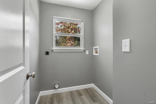 laundry area featuring light hardwood / wood-style flooring, hookup for a washing machine, and electric dryer hookup