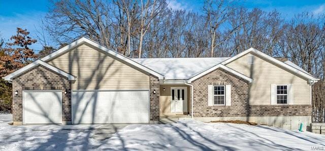 single story home with a garage