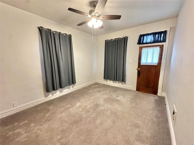 carpeted empty room with ceiling fan