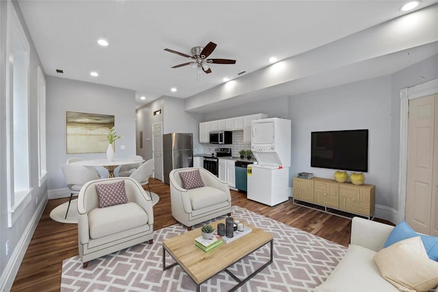 living room with hardwood / wood-style flooring and ceiling fan