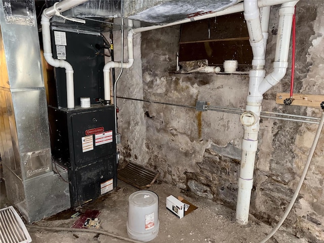 utility room featuring heating unit