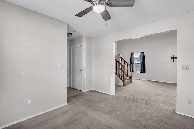 carpeted empty room with ceiling fan