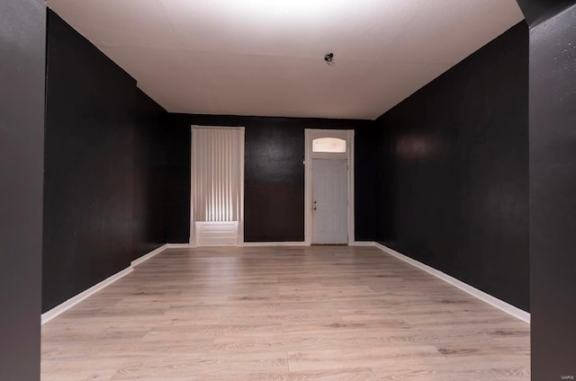 spare room with light hardwood / wood-style floors