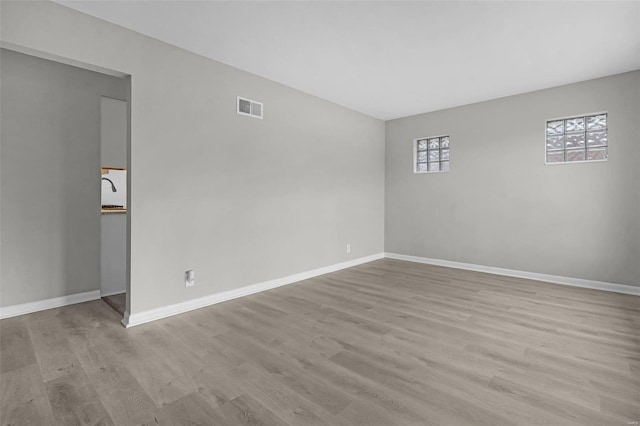 unfurnished room with light hardwood / wood-style floors