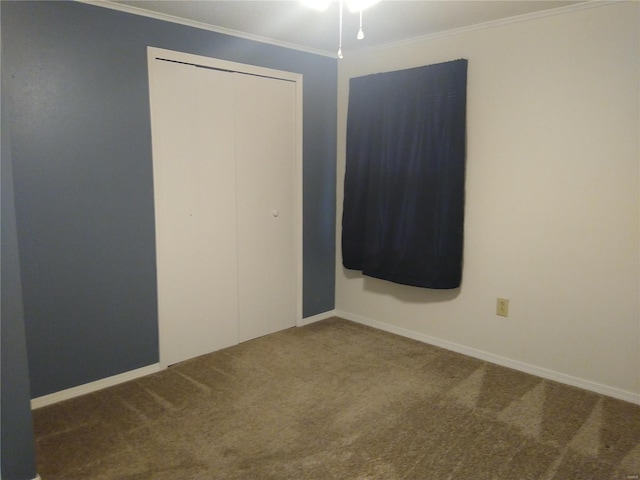 spare room with carpet flooring and crown molding