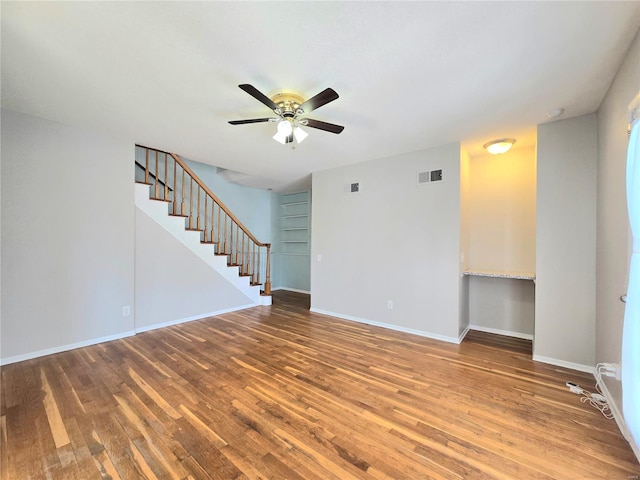 unfurnished room with hardwood / wood-style flooring and ceiling fan