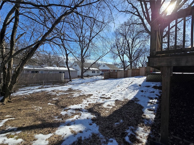 view of yard covered in snow