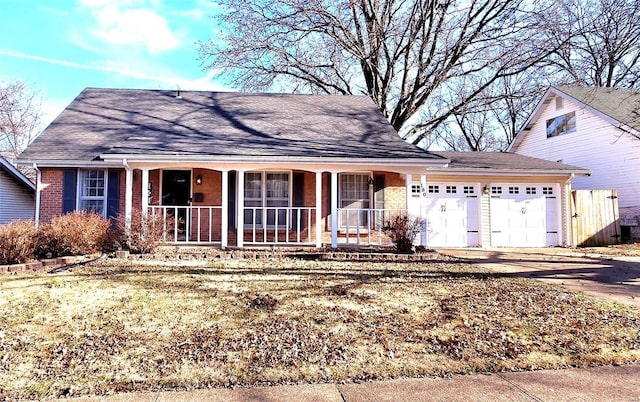 view of front facade with a garage and covered porch