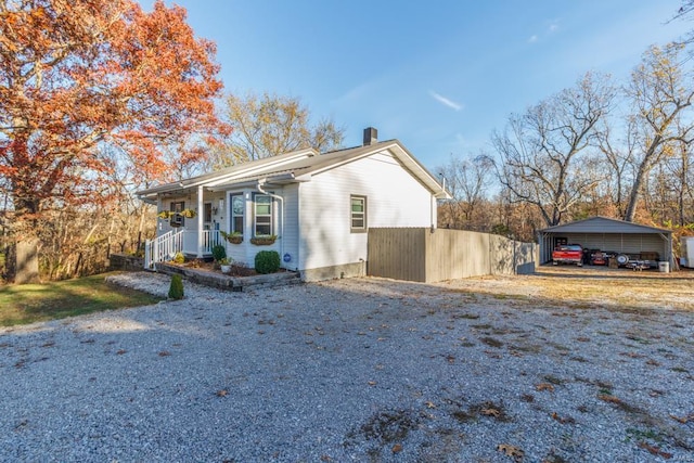 view of home's exterior featuring a carport