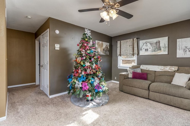 carpeted living room with ceiling fan