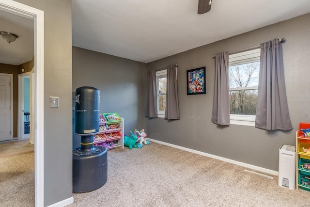 recreation room featuring carpet flooring and ceiling fan