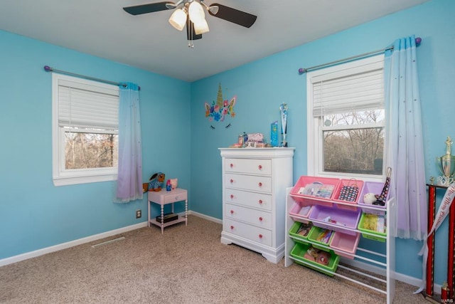 game room featuring ceiling fan and light colored carpet