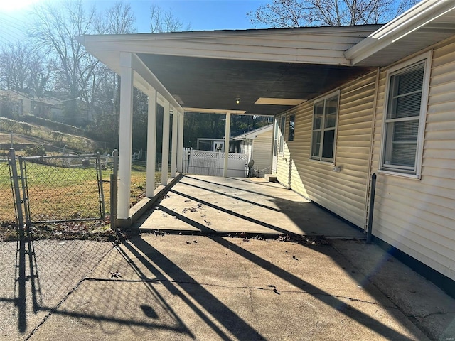 exterior space with a carport