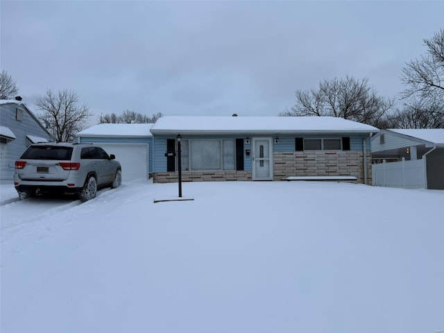 single story home featuring a garage