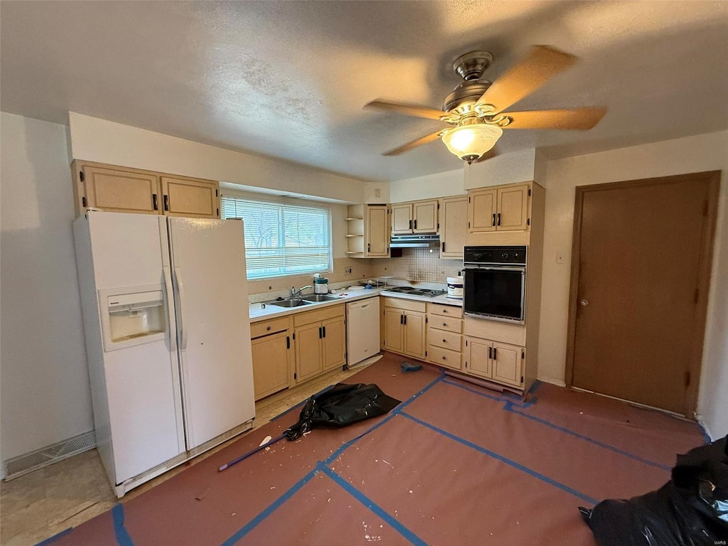 kitchen featuring tasteful backsplash, light brown cabinets, white appliances, and sink