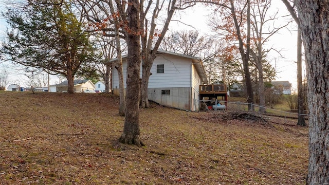 view of home's exterior featuring a deck