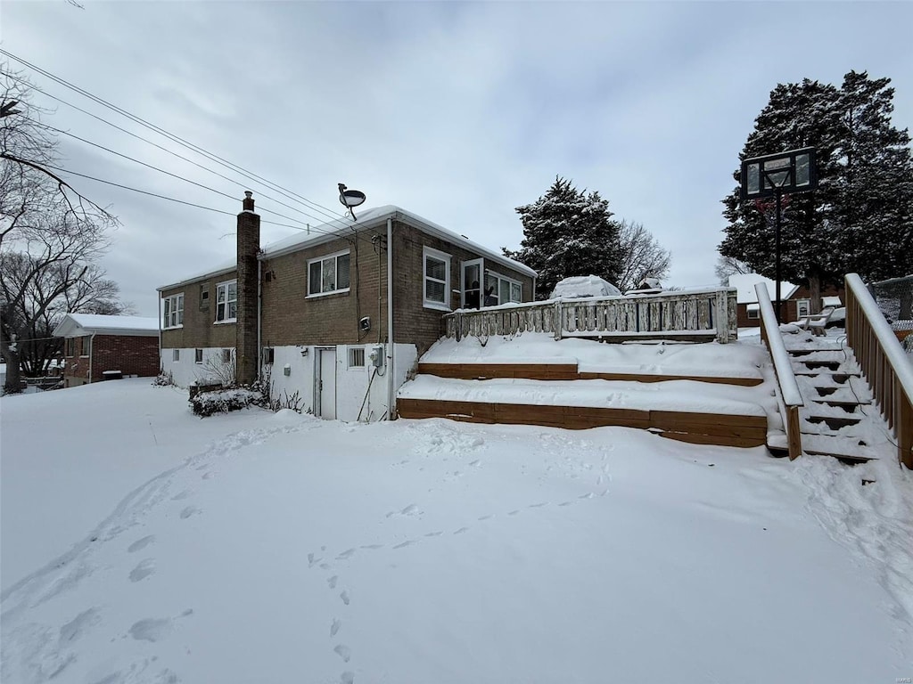 view of snow covered property