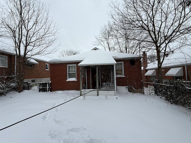 view of snow covered property