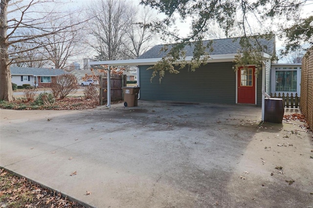 view of front of property featuring a carport