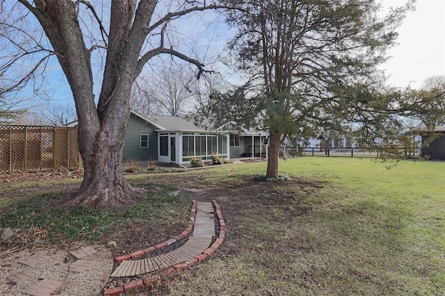 view of yard featuring a sunroom