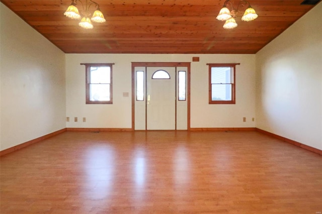 foyer entrance featuring wood ceiling, a chandelier, and hardwood / wood-style flooring