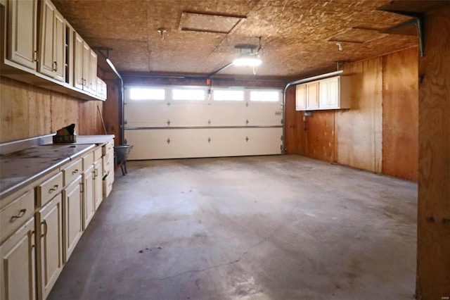 garage featuring wood walls