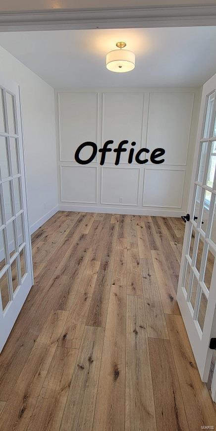 interior space with french doors and light wood-type flooring