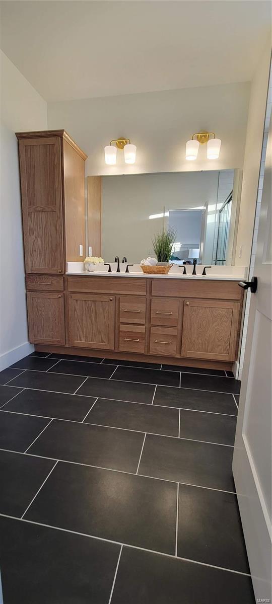 bathroom with tile patterned floors and sink