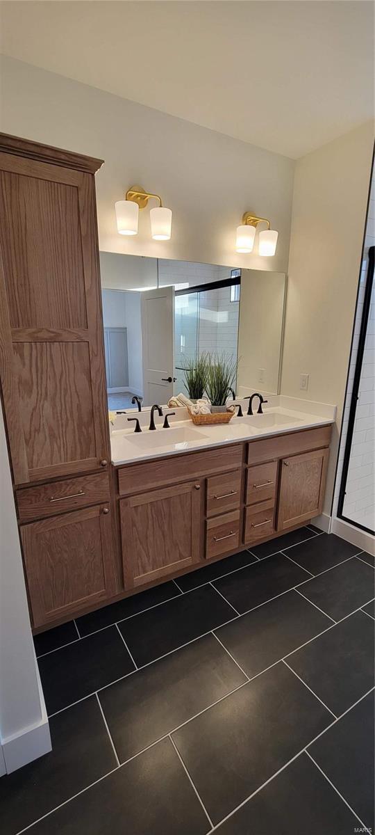 bathroom with vanity and tile patterned flooring