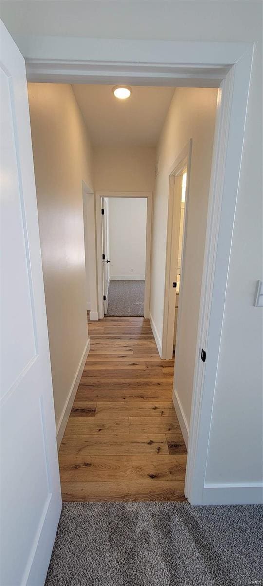 hallway featuring hardwood / wood-style floors