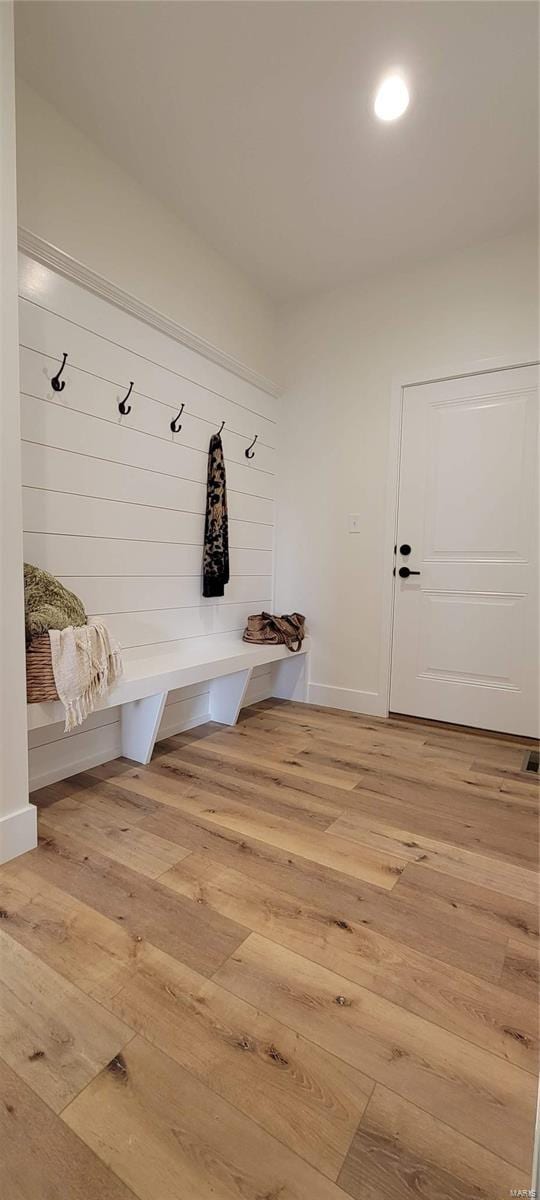 mudroom with wood-type flooring