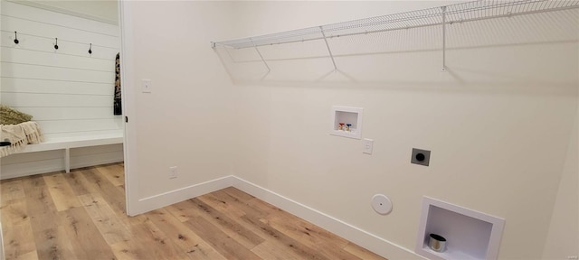 clothes washing area with washer hookup, hookup for a gas dryer, hardwood / wood-style floors, and electric dryer hookup