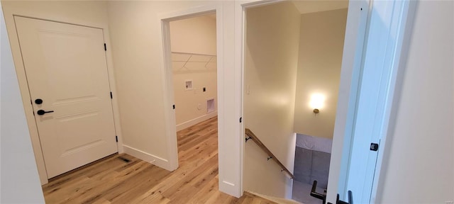 hallway with light wood-type flooring