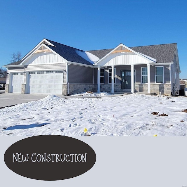 view of front of house with a porch and a garage