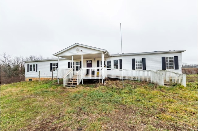 rear view of property with covered porch