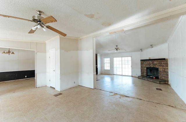 unfurnished living room featuring lofted ceiling, ceiling fan, a fireplace, and a textured ceiling