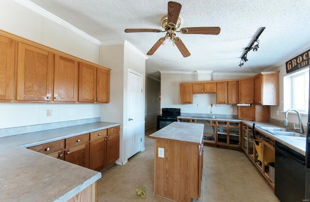 kitchen featuring rail lighting, a textured ceiling, a center island, and sink