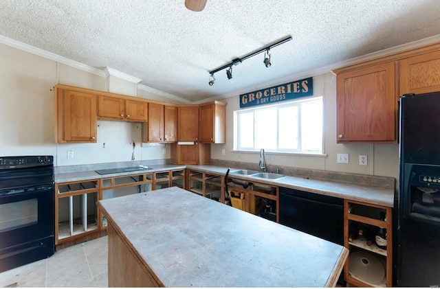 kitchen featuring black appliances, sink, ornamental molding, and a textured ceiling