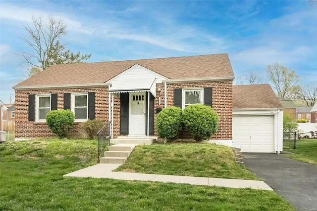 view of front facade with a front yard and a garage